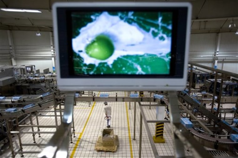 An advertisement video appears on a screen in a diary factory owned by Yili Industrial Group Co., one of China's largest dairy producers. The rumors spread by Internet that its baby formula might harm infants played on the worst fears of jittery parents.
